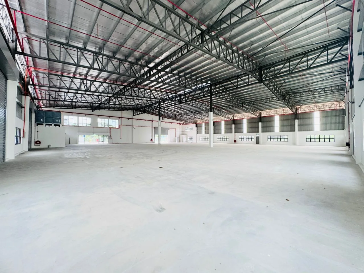 Warehouse interior showing the floor, roof structure and steel columns