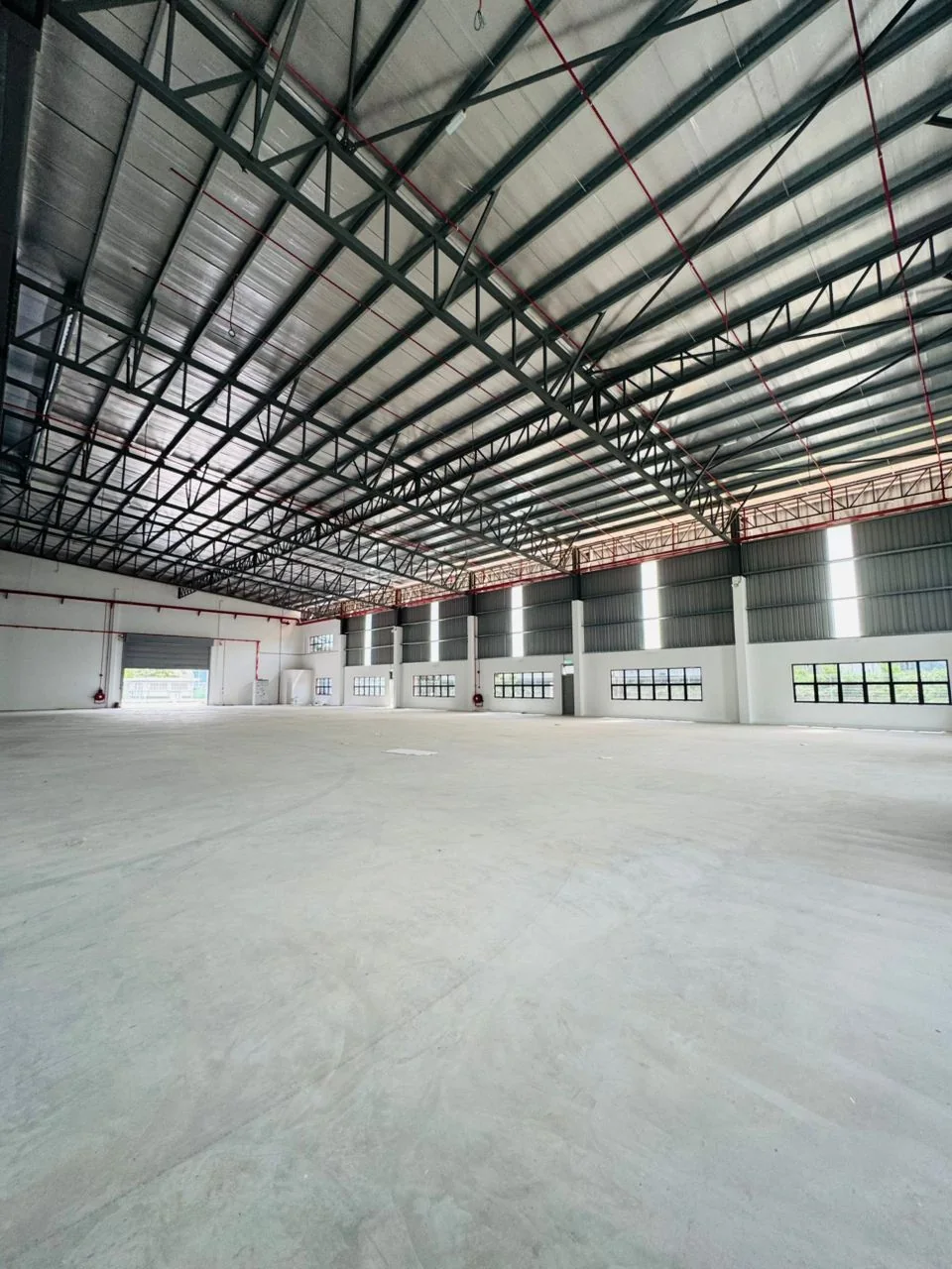 Interior view of the warehouse floor and roof framing
