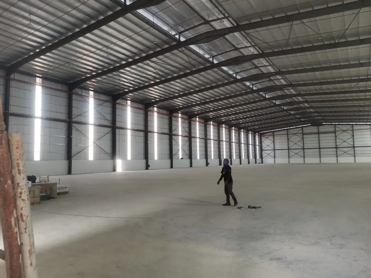 Wide warehouse interior and steel roof structure