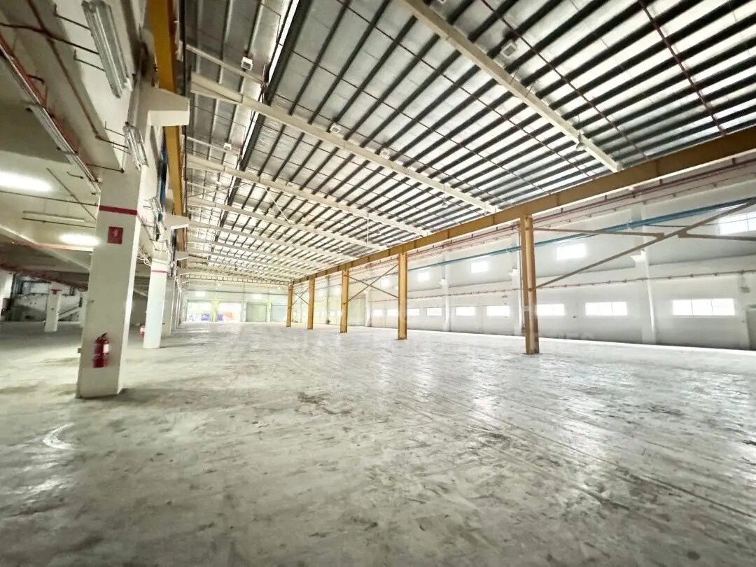 Factory interior showing structural columns and clear production space